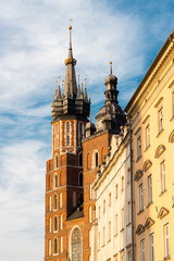 Obraz premium The old street of Krakow. The Mariama church in Krakow, Poland. Summer. Blue Sky. Travel. Background. 
