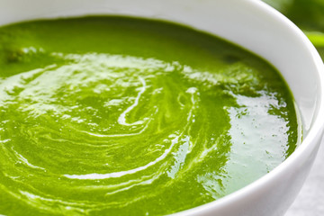 Bowl with tasty spinach soup, closeup