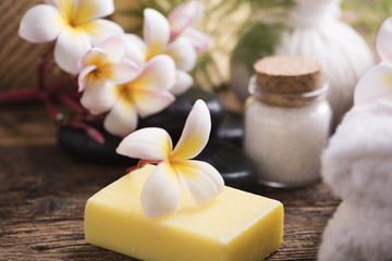 Spa stones with towel and plumeria