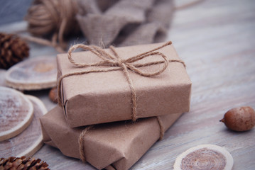 Rustic Christmas gift boxes on wooden background