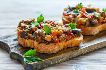 Toasted corn bread with baked vegetables.