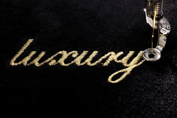 embroidery of gold lettering 