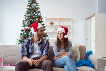 Fototapeta premium Happy couple celebrating christmas holiday