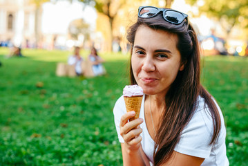 young pretty woman take a rest in shadow with ice cream