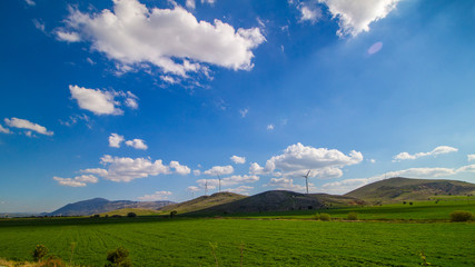 Amazing green hills and windmill in Turkey. © khomlyak