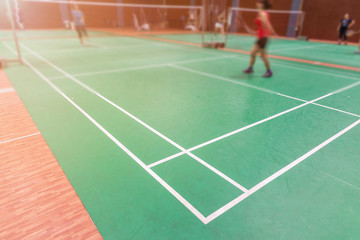badminton court with blurred background woman playing badminton
