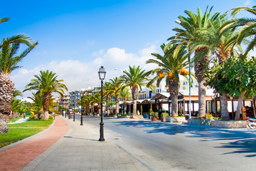 Fototapeta na wymiar Promenade with palm trees in the old town — Rethymno, Crete, Greece