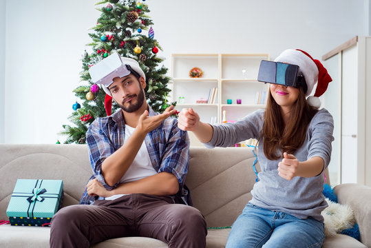 Happy Family Using Virtual Reality VR Glasses During Christmas