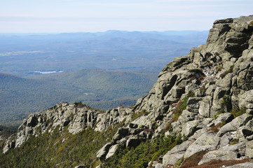 Rocks and Adirondack Mountains view from top of Whiteface Mountain in fall, New York State, USA.