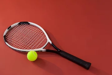 Zelfklevend Fotobehang High angle view of tennis racket and fluorescent yellow ball © WavebreakMediaMicro