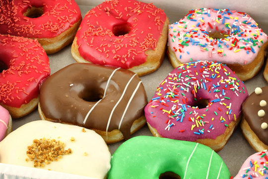 Bright and colorful donuts close-up in a box