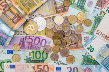 bitcoin, litecoin, euro coin and bills, money concept