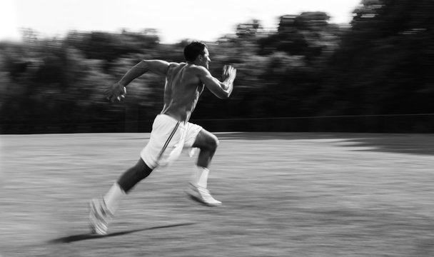 Athletic man running and training for sports