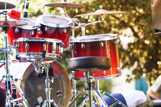 Set of drums outdoor with blurred background.