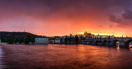 Fototapeta premium Fantastic natural phenomena summer storm over Charles bridge, Prague castle and Vltava river in Prague, Czech Republic