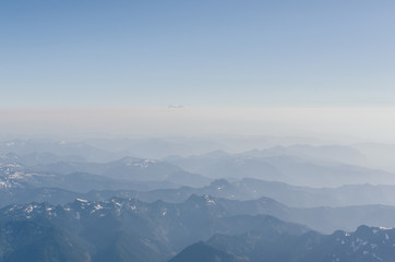 Breathtaking aerial view on mountains in fog