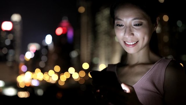 Asian Woman using smart phone in the city