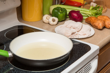 preparing meal fried chicken with healthy vegetables at home