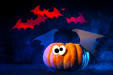 Halloween. Pumpkin with bats. Red Vampires.
