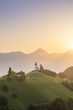 The iconic Jamik church, with Mount Triglav on the background. Jamnik, Kranj, Upper Carniola, Slovenia.