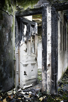A doorway in a burnt out building