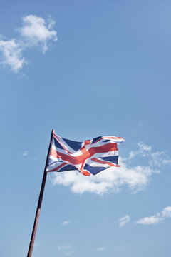 Union Jack flag against blue sky