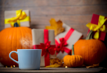 leaves and pumpkin with Halloween gift box and Tea