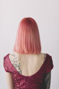 portrait of young woman with pink hair