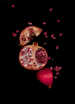 Pomegranate in a black background