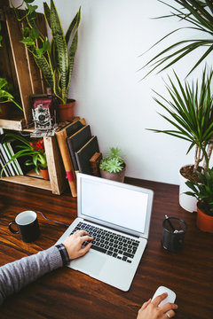 Closeup of a woman working in a vintage creative office.
