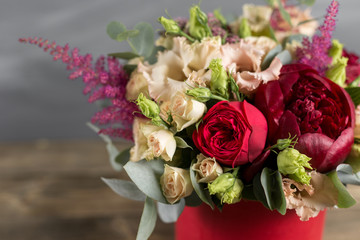 Bridal bouquet and boutonniere. Red and peach color flowers