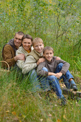 Fototapeta premium family sitting in park 