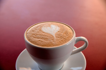 one cappuccino cup on table