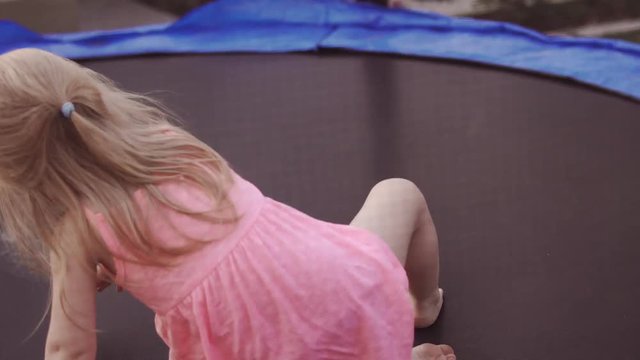 Happy Child Jumping on Trampoline. Funny Action in 4k, UHD.