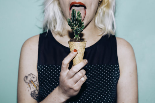 woman licking a cactus ice cream