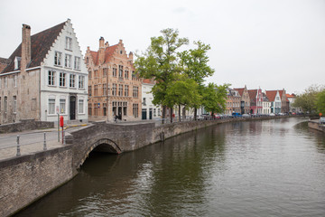 Fototapeta na wymiar Scenic cityscape with Green canal,