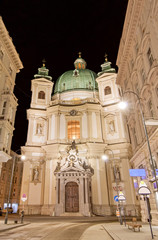 Green dome and facade of Peterskirche, St Peters Church, Vienna, Austria