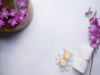 Spa still life concept,Close up of spa theme on white wood background with burning candle and orchid
