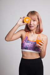 Beautiful Asian healthy girl with orange juice and orange fruit.