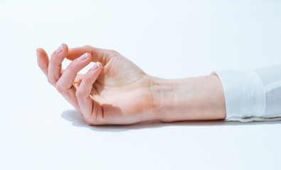 Female's hand over white background.