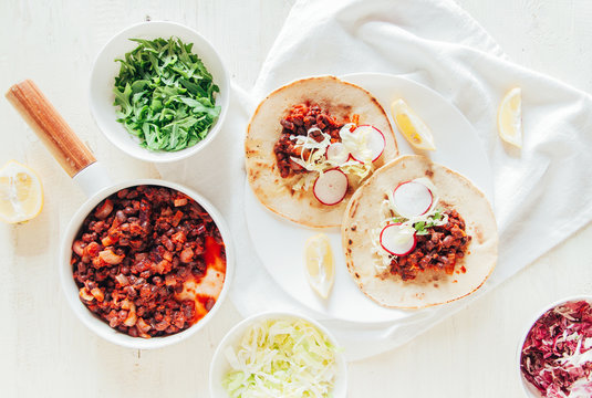 Tacos with azuki beans, salad and yogurt salsa