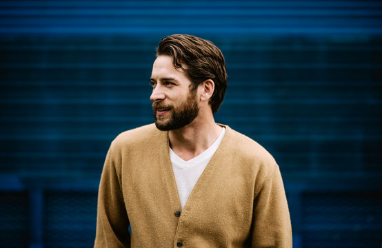 Profile of a man wearing a cardigan