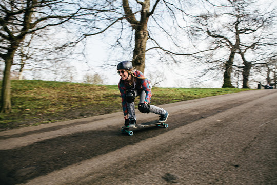 Woman practicing downhill longboarding
