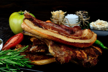 pork meat with vegetables on table