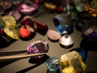 Jewel or gems on black shine color, Collection of many different natural gemstones amethyst, lapis lazuli, rose quartz, citrine, ruby, amazonite, moonstone, labradorite, chalcedony, blue topaz