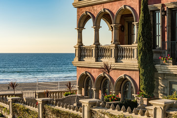 Beach boardwalk by Italian style house