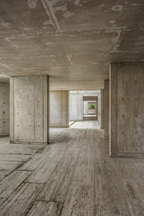 Cement modern urban architecture of the Salk Institute in San Diego with dark passageway tunnel