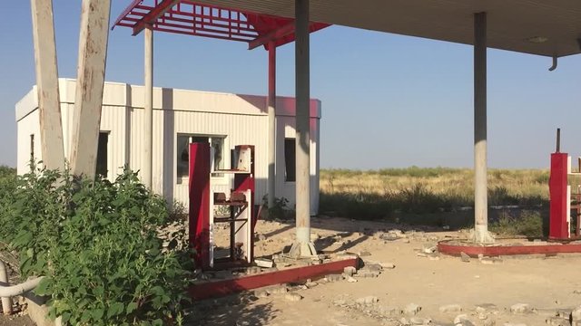 Old dirty gas station road 66. Abandoned gas station end of the world apocalypse petrol fuel slow motion video