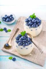 two glasses of  yogurt on a wooden background  ,top view