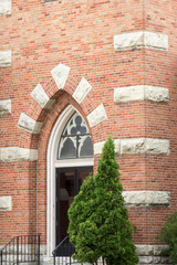Corner and front door on St Willebrord Catholic Church in Green Bay, WI - obrazy, fototapety, plakaty